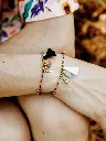 bracelet-charm-s-multicolore-leopard-avec-pompon_a12755e7-0814-4641-a3b6-994e03340e86.webp